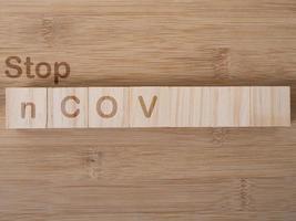 stop ncov  word written on wood block. stop coronavirus text on wooden