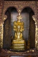 close up Buddha statue gilded in the measure photo