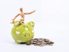 puppet doll and piggy bank ,isolate white background with clipping path photo