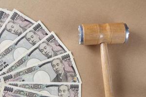 Wooden gavel and money photo