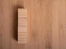 Wooden floor with empty wooden cubes as a template for words photo