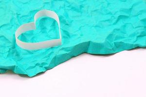 Paper hearts on green background photo