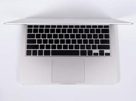 Top view of modern retina laptop, isolated on white background photo
