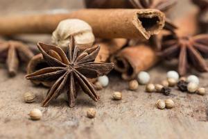 Spices lying on a wooden surface closeup photo