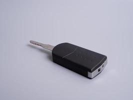 Car key with remote control isolated on gray background. photo