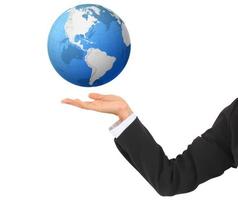 conceptual image of a big globe on hands photo