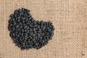 black beans on sack background. photo