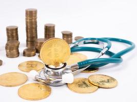 Cryptocurrency medical concept with a gold bitcoin coin photo