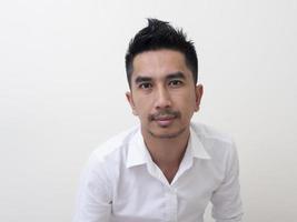 Portrait of smiling young man wearing white  shirt photo