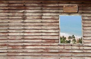 an wooden door with a window and cloudy sky photo