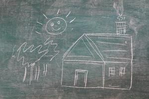 House under the sun drawn in chalk on a blackboard photo