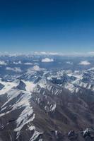 Himalaya mountains under clouds photo