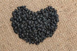 black beans on sack background. photo