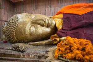 Reclining Buddha gold statue photo