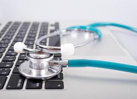 Stethoscope on computer ready to work photo