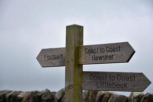 Wooden Coast to Coast Sign Post on the Route photo