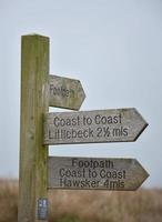 Wood Way Marker Along Coast to Coast Showing Distances photo