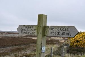 Distances to Littlebeck and Hawsker on Coast to Coast Sign photo