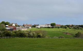 Farm Out Buildings in Northern England Surrounded by Fields photo