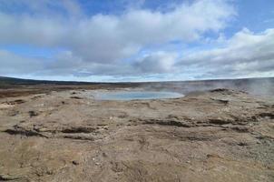 Beautiful scenic view of a natural steaming geysir photo