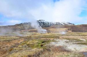 A field in Iceland with a scenic view of the geysirs photo