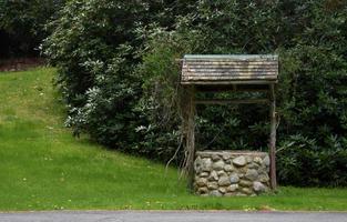 Old Stone and Rustic Wood Wishing Well photo