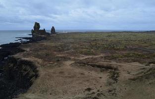 Amazing Seascape with a View of Londrangar in Iceland photo