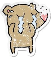 distressed sticker of a cartoon crying bear vector