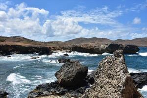 Crashing Waves Along the Rugged Aruban Coastline photo
