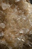 Cluster of Clear Crystal Quartz Geodes Growing photo