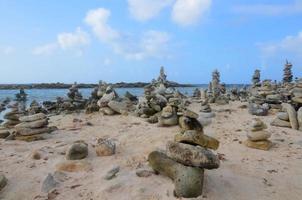 Collection of Stone Cairns on Baby Beach photo