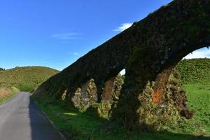 Water Channel with Archways in the Countryside of Sao Miguel photo