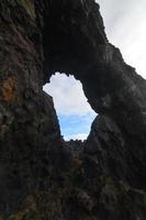 Window Through a Rock Formation in Iceland photo