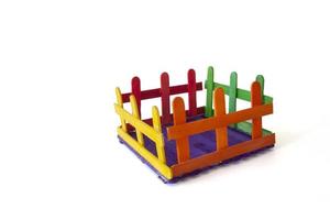 Invention of toys from colorful popsicle sticks isolated on white background. photo