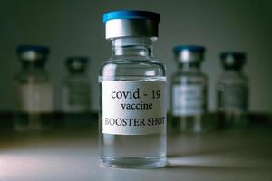 COVID-19 booster vaccine vials. Medicine and health care concept photo
