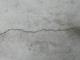Concrete cement wall with crack in industrial building, great for your design and texture background photo