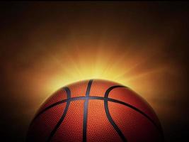 basketball ball. on black background with smoke, yellow orange red white colored back lights photo