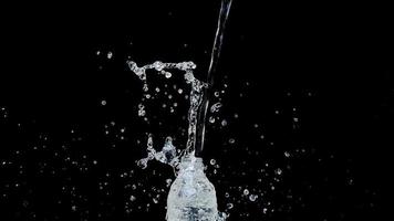 Abstract water jet crashes on a black background photo