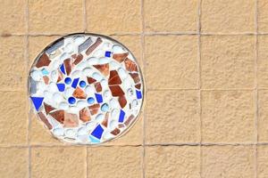 mosaic wall decorative ornament from ceramic broken tile photo