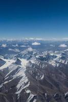 Himalaya mountains under clouds photo