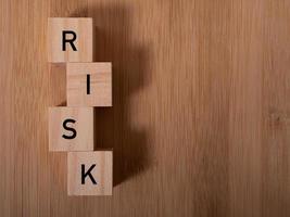Word risk writing with wooden blocks photo