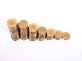 Savings, increasing columns of gold coins isolated on white background photo