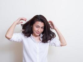 Portrait of young asian woman standing and smiling photo