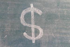 US Dollar sign written on a blackboard photo