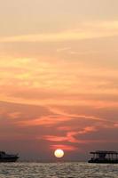 long tail boats at sunset at Koh Lipe photo