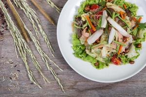 Thai salad with carrot, tomato, glass noodle, celery and pork photo