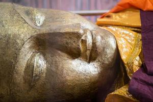 Reclining Buddha gold statue photo