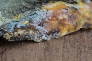 Mouldy bread on cutting board photo