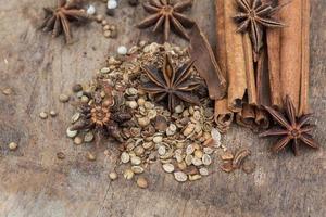 Spices lying on a wooden surface closeup photo