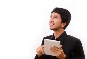 Happy man using digital tablet photo